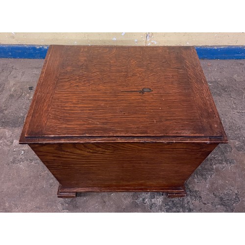 148 - OAK TRAPEZIUM SHAPED COAL BOX ON WHEELS