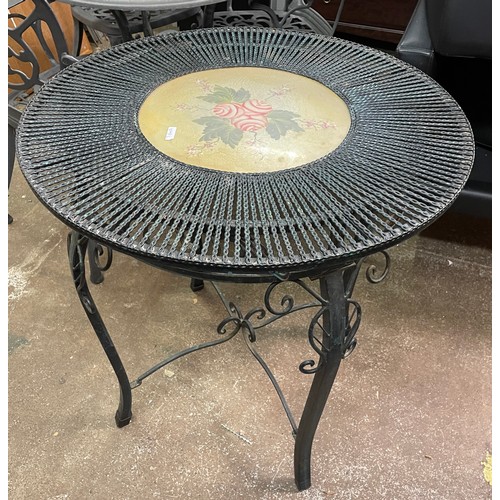 60A - CAST METAL CIRCULAR GARDEN PATIO TABLE AND TWO FOLDING CHAIRS WITH DECORATIVE PANEL BACKS