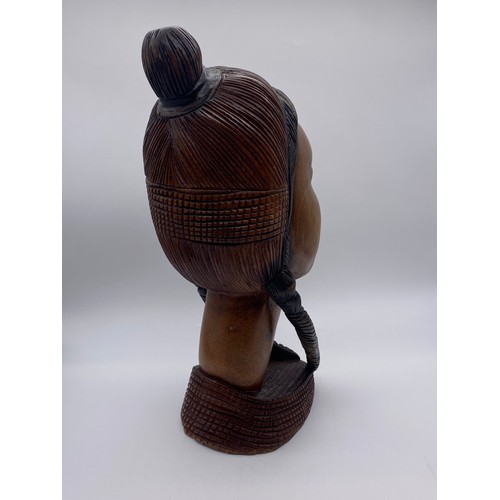 591 - CARVED AFRICAN WOODEN PORTRAIT BUST OF A FEMALE