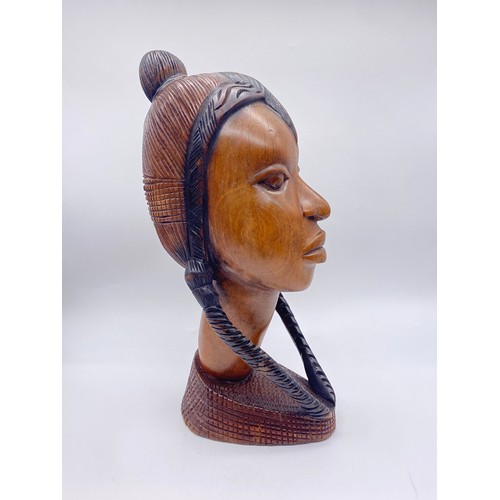 591 - CARVED AFRICAN WOODEN PORTRAIT BUST OF A FEMALE