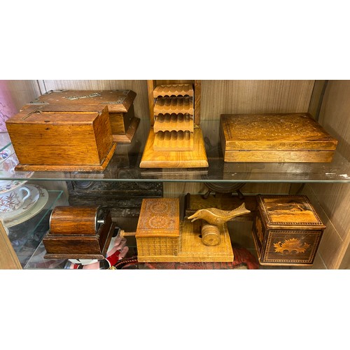 574 - TWO SHELVES OF CARVED NOVELTY TABLE TOP CIGARETTE DISPENSERS AND BOXES