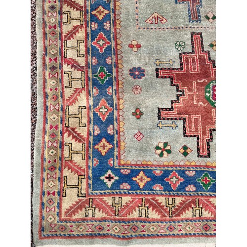 80 - EARLY 20TH CENTURY GEOMETRIC PATTERN FRINGED CARPET