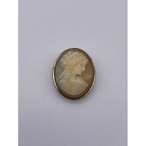 457 - BASE METAL MOUNTED CARVED OVAL CAMEO BROOCH, TURQUOISE CERAMIC BROOCH AND A SMALL CITRINE BAR BROOCH