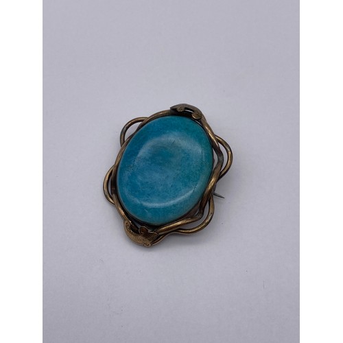 457 - BASE METAL MOUNTED CARVED OVAL CAMEO BROOCH, TURQUOISE CERAMIC BROOCH AND A SMALL CITRINE BAR BROOCH