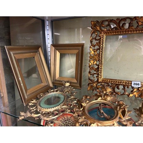 266 - SHELF OF ORNATE GILT SCROLLED PHOTOGRAPH FRAMES