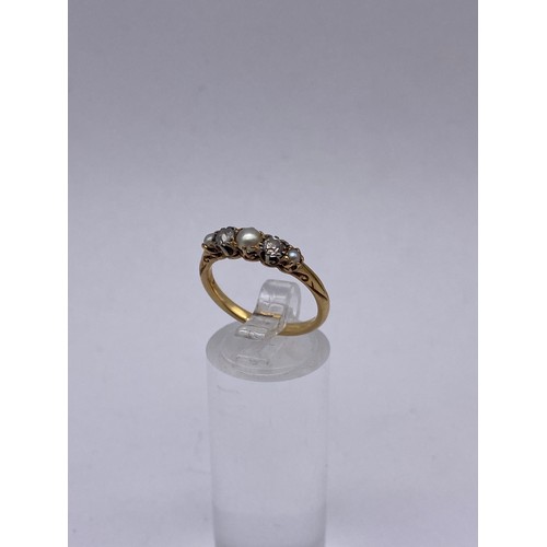 524 - 18CT GOLD DIAMOND AND PEARL CHANNEL SET RING 2.9G APPROX