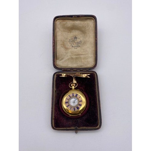 536 - 18K GOLD CASED FOB WATCH WITH BLUE ENAMEL CHAPTER RING ON 9CT GOLD BOW TIE BROOCH 35G APPROX OVERALL