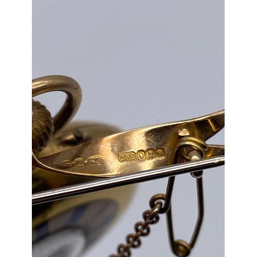536 - 18K GOLD CASED FOB WATCH WITH BLUE ENAMEL CHAPTER RING ON 9CT GOLD BOW TIE BROOCH 35G APPROX OVERALL