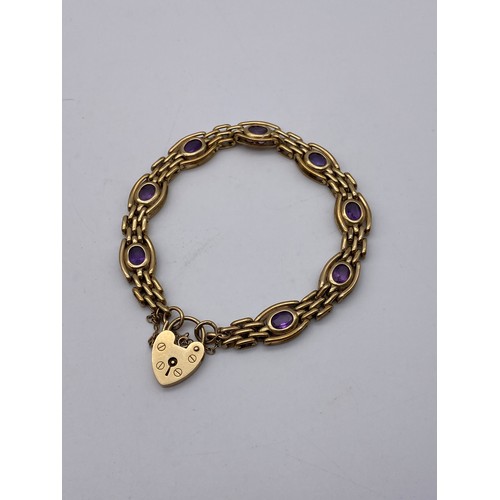 542 - 9CT GOLD GATE BRACELET WITH AMETHYST SET LINKS PADLOCK AND SAFETY CHAIN 19.8G APPROX