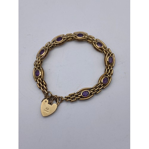 542 - 9CT GOLD GATE BRACELET WITH AMETHYST SET LINKS PADLOCK AND SAFETY CHAIN 19.8G APPROX