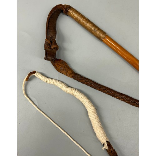 434 - METAL MOUNTED RIDING CROP