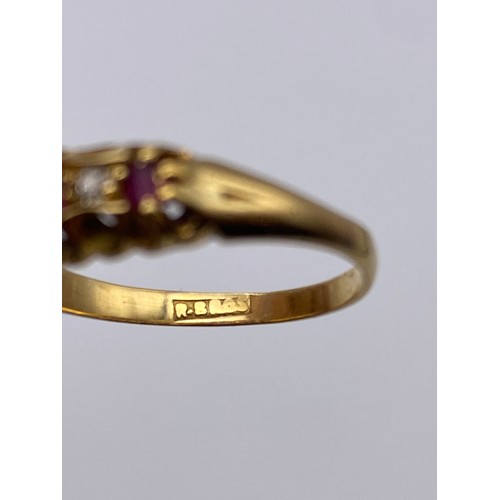 527 - UNMARKED YELLOW METAL RUBY AND DIAMOND CHANNEL SET RING 3.5G APPROX.