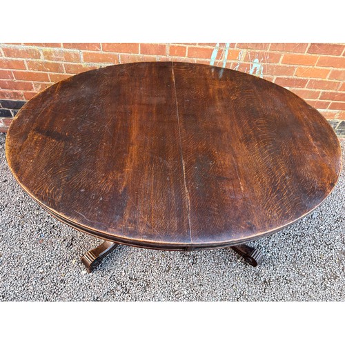 22 - 19TH CENTURY OVAL OAK EXTENDING DINING TABLE