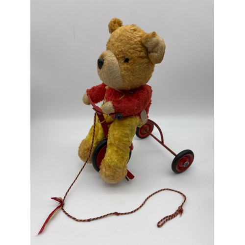 373 - SMALL PLUSH TEDDY BEAR RIDING A TRICYCLE