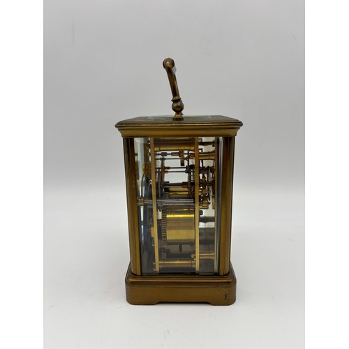 581 - FRENCH LACQUERED BRASS CASED CARRIAGE CLOCK THE ENAMEL DIAL RETAILED BY CURTIS AND SPRIGGS PARIS