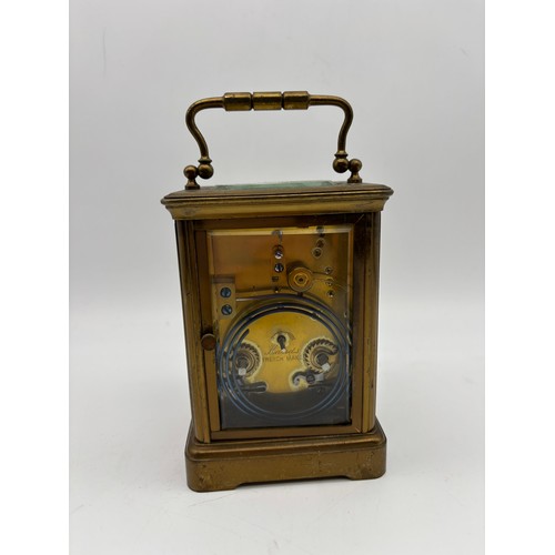 581 - FRENCH LACQUERED BRASS CASED CARRIAGE CLOCK THE ENAMEL DIAL RETAILED BY CURTIS AND SPRIGGS PARIS