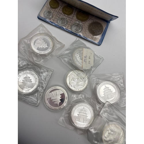 484 - EIGHT CHINESE PANDA YUAN COINS PLUS PROOF SET OF COINS