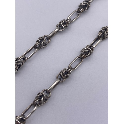 460 - 925 SILVER KNOT LINK BRACELET WITH HEART PENDANT AND T BAR FASTENER 14.5G APPROX