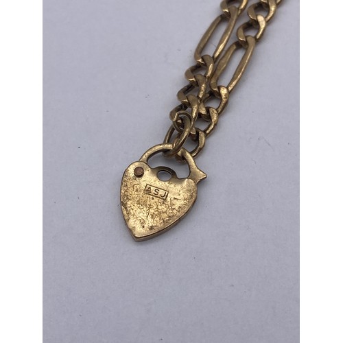 429 - 9CT GOLD FLAT CURB BRACELET WITH HEART PADLOCK 2.3G APPROX