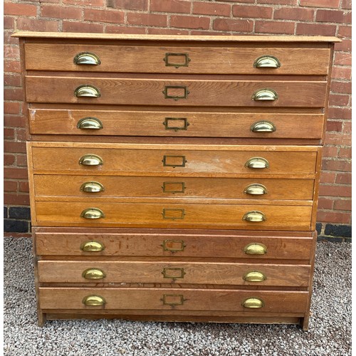 132A - THREE SECTION OAK NINE DRAWER PANELLED PLAN CHEST