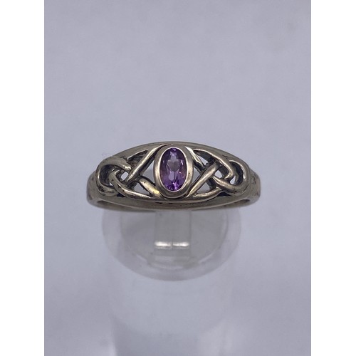 444 - SILVER AMETHYST CELTIC DESIGN DRESS RING AND A METAL INTERLACED DRESS RING