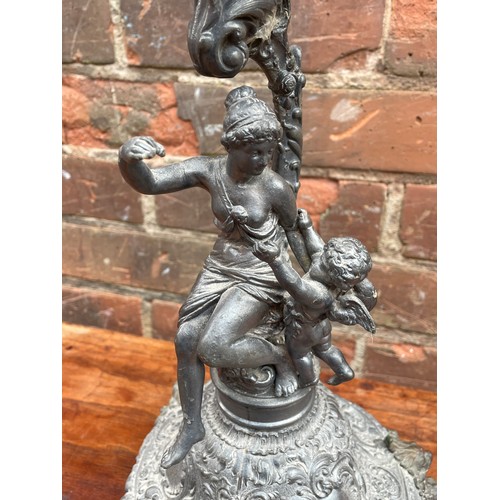 409 - BASE METAL MAIDEN AND CHERUB FIGURAL CANDLE HOLDER