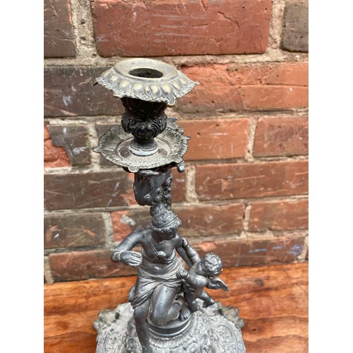 409 - BASE METAL MAIDEN AND CHERUB FIGURAL CANDLE HOLDER