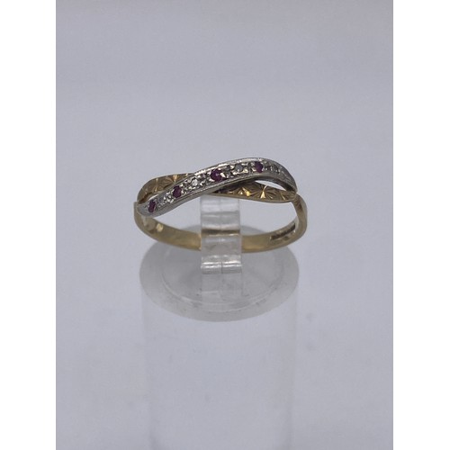 458 - 9CT GOLD RUBY AND DIAMOND CHIP CROSSOVER RING SIZE O 1.6G APPROX