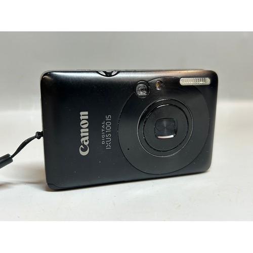 424 - CANON DIGITAL IXUS DIGITAL CAMERA AND A SMALL KINDLE