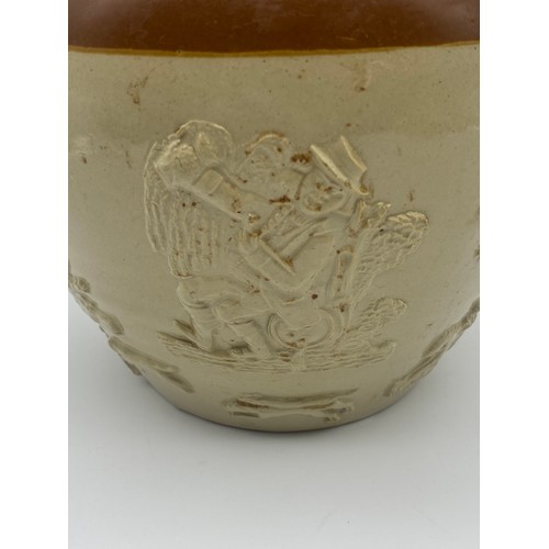 594 - LARGE STONEWARE RELIEF MOULDED JUG WITH METAL LID