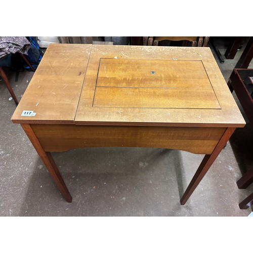 117 - ELECTRIC SEWING MACHINE IN TABLE