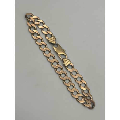 737 - 9CT FLAT CURB LINKED BRACELET, 22.5 GRAMS APPROX.