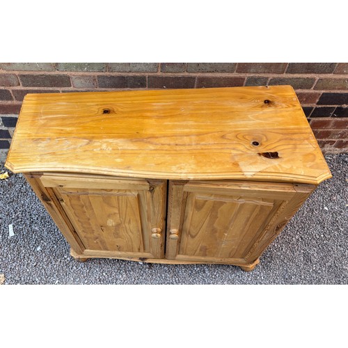 54 - PINE TRAPEZIUM TWO DOOR CUPBOARD