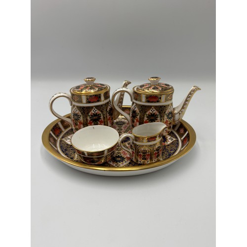 513 - ROYAL CROWN DERBY IMARI PATTERNED MINIATURE TEA SET ON OVAL TRAY (SECONDS)