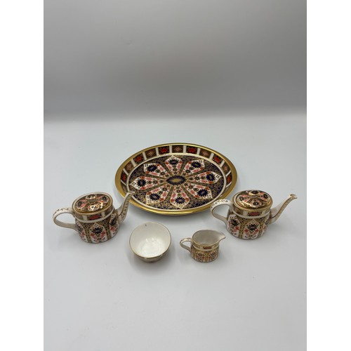 513 - ROYAL CROWN DERBY IMARI PATTERNED MINIATURE TEA SET ON OVAL TRAY (SECONDS)