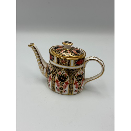 513 - ROYAL CROWN DERBY IMARI PATTERNED MINIATURE TEA SET ON OVAL TRAY (SECONDS)