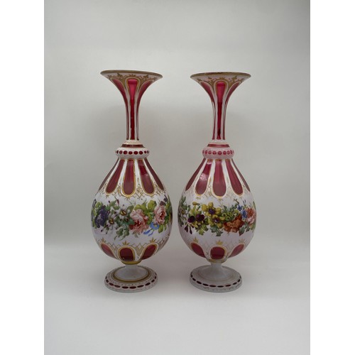 550 - PAIR OF BOHEMIAN RUBY GLASS FACETED AND FLORAL PAINTED VASES
