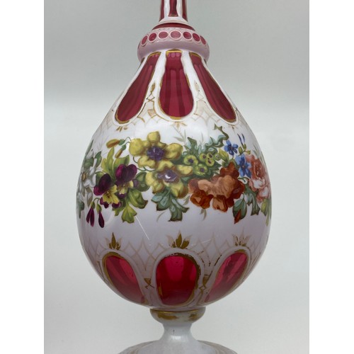 550 - PAIR OF BOHEMIAN RUBY GLASS FACETED AND FLORAL PAINTED VASES