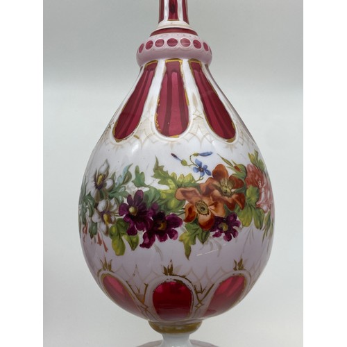 550 - PAIR OF BOHEMIAN RUBY GLASS FACETED AND FLORAL PAINTED VASES