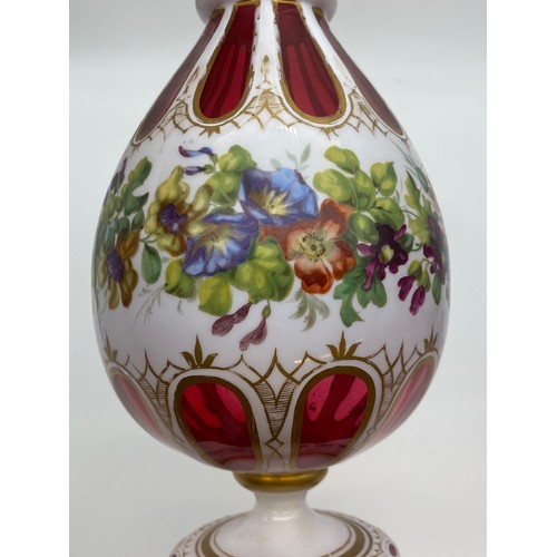 550 - PAIR OF BOHEMIAN RUBY GLASS FACETED AND FLORAL PAINTED VASES