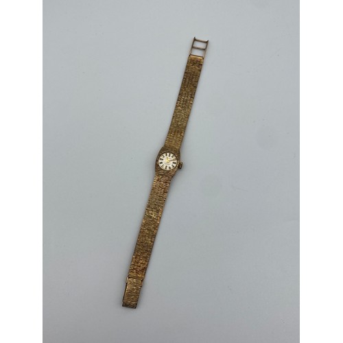 568 - LADIES SHIELD 9CT GOLD 17 JEWEL WRISTWATCH ON TEXTURED 9CT GOLD STRAP 24G