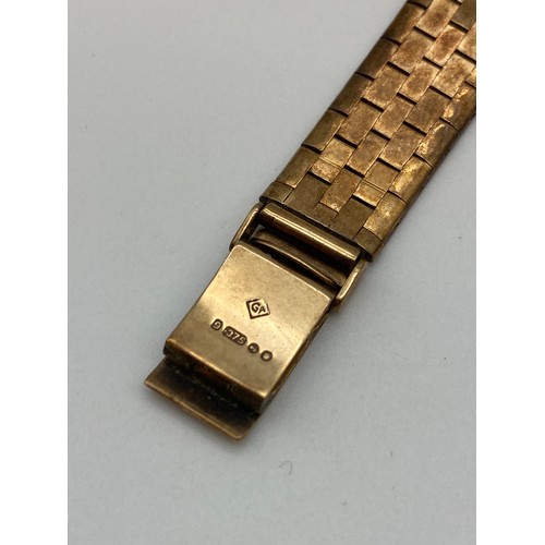 568 - LADIES SHIELD 9CT GOLD 17 JEWEL WRISTWATCH ON TEXTURED 9CT GOLD STRAP 24G
