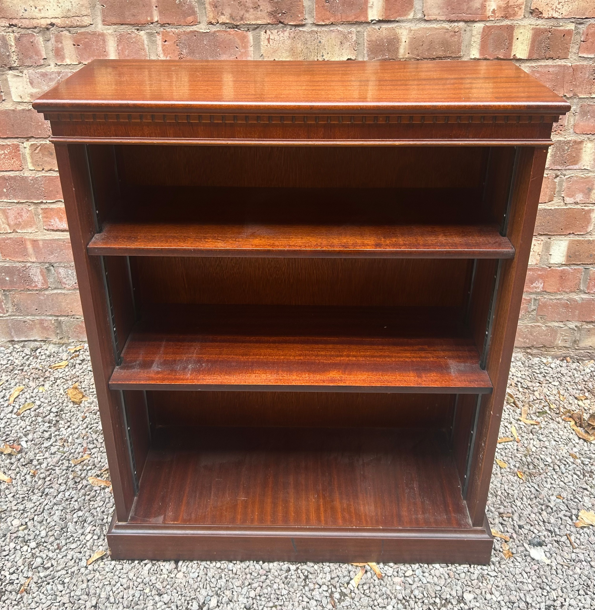 REPRODUCTION MAHOGANY DWARF BOOKCASE WITH DENTIL FRIEZE