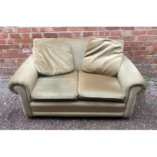 87 - EDWARDIAN STYLE GREEN UPHOLSTERED SOFA ON BUN FEET