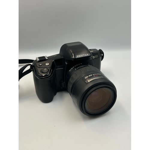 774 - PENTAX Z10, MINOLTA AF-S AND A CANON SURE SHOT Z135, PLUS A PAIR OF PRAKTICA SPORT 10X25 BINOCULARS