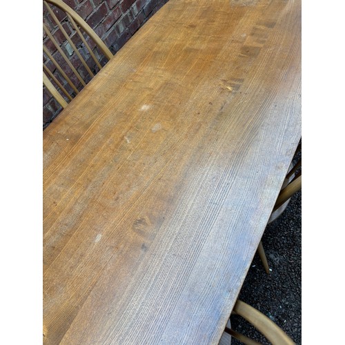 100A - ERCOL 513 BLONDE ELM RECTANGULAR DINING TABLE AND SIX HOOP BACK CHAIRS.