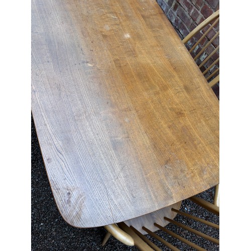 100A - ERCOL 513 BLONDE ELM RECTANGULAR DINING TABLE AND SIX HOOP BACK CHAIRS.