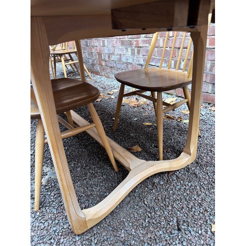 100A - ERCOL 513 BLONDE ELM RECTANGULAR DINING TABLE AND SIX HOOP BACK CHAIRS.