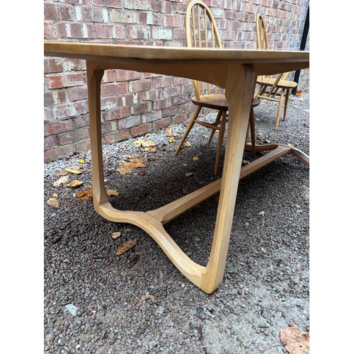 100A - ERCOL 513 BLONDE ELM RECTANGULAR DINING TABLE AND SIX HOOP BACK CHAIRS.