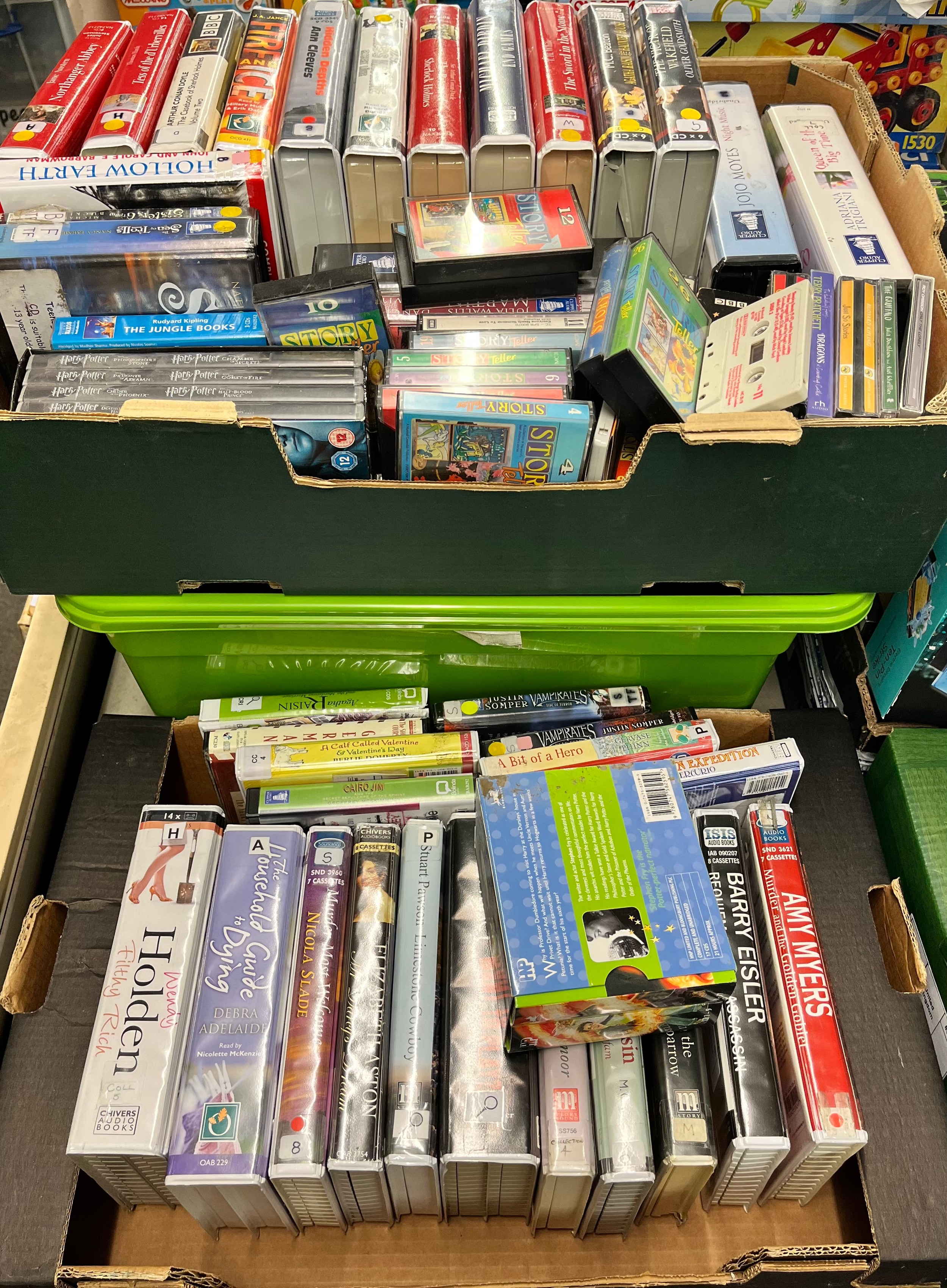 THREE CARTONS OF ASSORTED CASETTE AUDIO BOOKS AND GAME TAPES